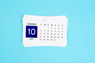 Ekim Takvimi 2024 mavi renk arkaplanı sayfası.