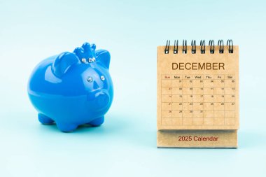 Blue piggy bank and blank December 2025 calendar, Reminder schedule of savings money concepts. clipart