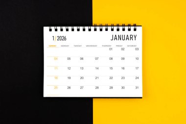 Ocak 2026 siyah ve sarı arkaplan takvimi, düz yatıyordu.