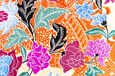 Soyut çiçek süsüyle el yapımı batik kumaş dokusu..