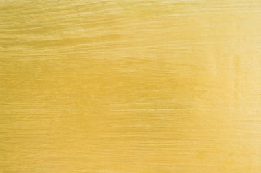 Arkaplan olarak altın rengi beton duvar dokusu.