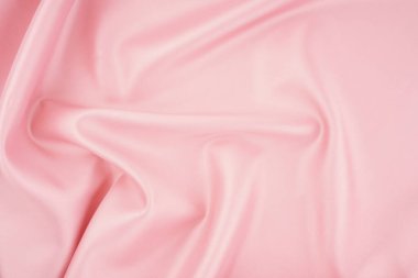 Pembe ipek ya da saten kumaş düğün arka planı olarak kullanılabilir. Lüks arkaplan tasarımı.