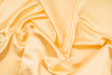 Güzel Dalgalı Açık Sarı İpek Kumaş. Lüks Ürünler İçin Zarif Arkaplan.