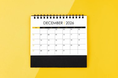 Randevu almak için 2026 yılının Aralık ayı takvimi sarı zemin üzerinde.