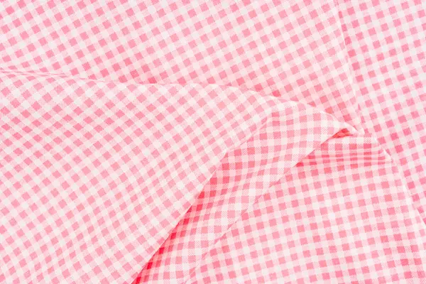 Kırışık klasik pembe ekose kumaş veya masa örtüsü arkaplanı.
