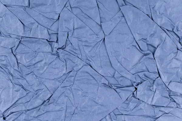 Arkaplan olarak mavi buruşmuş kağıt dokusu.