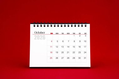 Ekim 2026 Kırmızı arkaplanda boş masa takvimi.