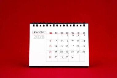 Aralık 2026 Kırmızı arkaplanda boş masa takvimi.