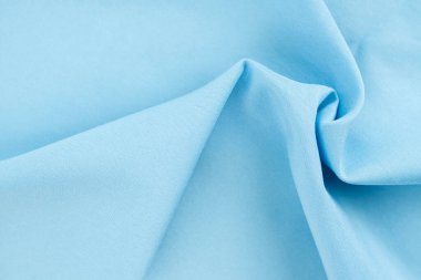 Mavi renk kumaş dokusu arka plan, pamuk desen detayı.