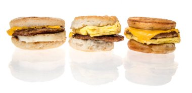 Winneconne, WI - 20 February 2024: A package of McDonalds sausage, egg, and cheese Mcgriddles, McMuffing and biscuit breakfast sandwiches on an isolated background. clipart