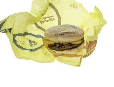 Winneconne, WI - 20 February 2024: A package of McDonalds sausage, egg, and cheese Mcmuffin on a wrapper an isolated background. clipart