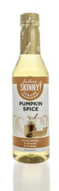 Winneconne, WI - 26 April 2024: A bottle of Jordans skinny syrups pumpkin spice flavoring on an isolated background. clipart