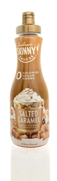 Stock image Winneconne, WI - 27 April 2024: A bottle of Jordans skinny sauces salted caramel sauce topping on an isolated background.