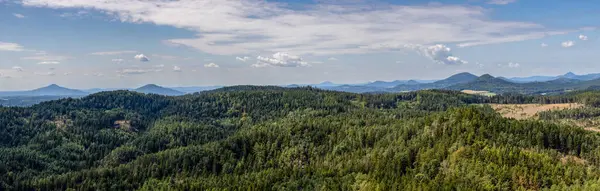 stock image Panoramic shot of beautiful summer landscape full of forests and hills under blue cloudy sky. Lusatian Mountains, Czech Republic, Europe.