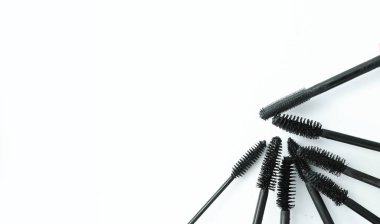 various mascara brushes on white background clipart