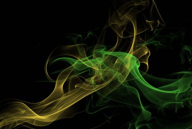 Siyah arkaplanda yeşil ve sarı ipeksi duman