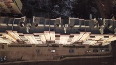 a view from a height from a quadrocopter drone to the new buildings of a new city building in Ukraine in Zhytomer in February 2020. Apartment buildings, streets, city, architecture. high quality