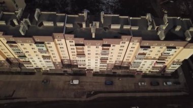 a view from a height from a quadrocopter drone to the new buildings of a new city building in Ukraine in Zhytomer in February 2020. Apartment buildings, streets, city, architecture. high quality