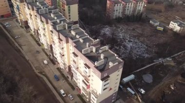 a view from a height from a quadrocopter drone to the new buildings of a new city building in Ukraine in Zhytomer in February 2020. Apartment buildings, streets, city, architecture. high quality