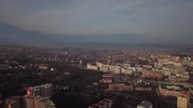 a view from a height from a quadrocopter drone to the new buildings of a new city building in Ukraine in Zhytomer in February 2020. Apartment buildings, streets, city, architecture. high quality