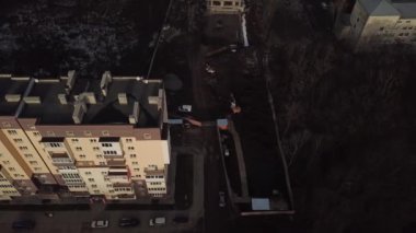 a view from a height from a quadrocopter drone to the new buildings of a new city building in Ukraine in Zhytomer in February 2020. Apartment buildings, streets, city, architecture. high quality