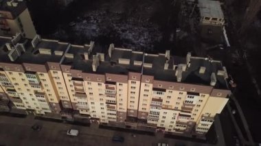 a view from a height from a quadrocopter drone to the new buildings of a new city building in Ukraine in Zhytomer in February 2020. Apartment buildings, streets, city, architecture. high quality