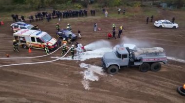 Emergency service firefighters during an exercise in Ukraine in Chernihiv in September 2021. Rescuers train to extinguish the fire and provide assistance to the victims. High quality bitrate 4k