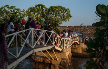 Galle, Sri Lanka - 02 20 2022: Crowded Butterfly bridge in Dharmapala park in the evening. clipart