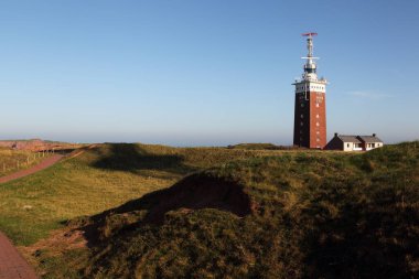 Lighthouse on Heligoland on a sunny day. clipart