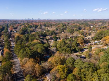 Aerial landscape of residential area and Atlanta skyline during fall at sunset in Decatur Atlanta Georgia USA clipart