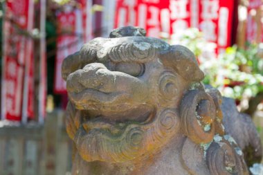 Enoshima island, Fujisawa, Kanagawa prefecture, Japan. Komainu are the guardians of shinto shrines and sometimes temples, usually in pairs, one with open mouth, and one with closed.