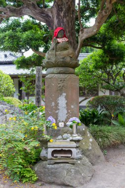 Stone statue of Ojizou san, protector of children and protector of travellers, Kamakura, Japan.