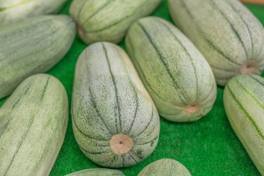 Karaui picking melons for sale at summer Farmers Market, Kanazawa, Japan.