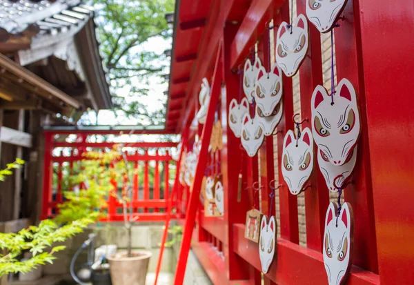 Red and white  ema prayer plaques at Asanogawa inari jinja, Kanazawa, Japan.