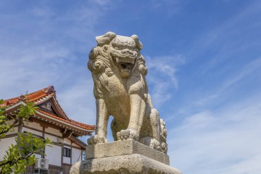 Komainu, or lion-dog, statue at shinto shrine, Japan.