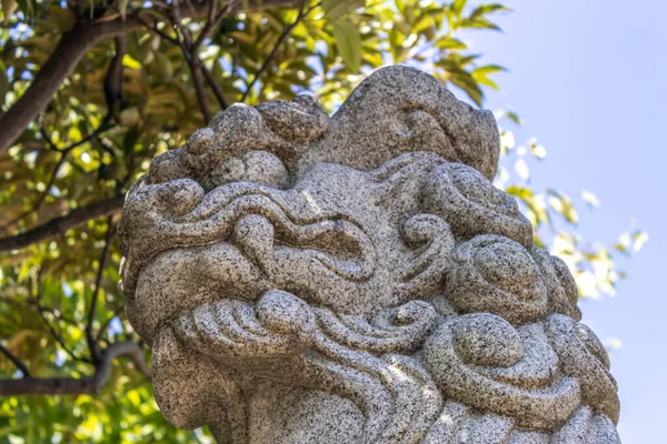 Komainu, or lion-dog (public art) at Kanaiwa, Japan. Komainu are the guardians of shinto shrines and sometimes temples, usually in pairs, one with open mouth, and one with closed.