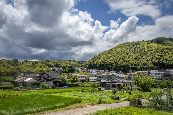 stock image Summer cumulonimbus clouds, or nyuudougumo, over river. Kanazawa, Japan.