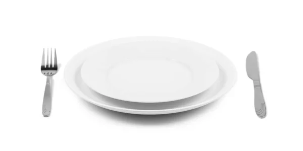 Δύο Στοιβαγμένα Λευκά Πιάτα Πιρούνι Και Μαχαίρι Πλαϊνή Όψη Απομονωμένα — Φωτογραφία Αρχείου