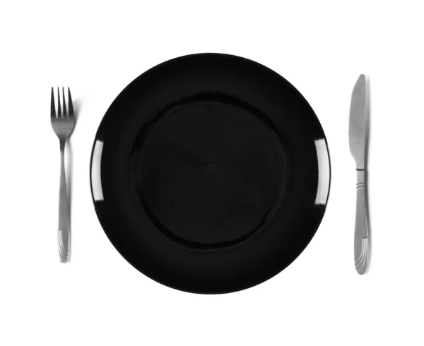 Черная Пустая Керамическая Тарелка Вилкой Ножом Вид Сверху Изолированный Белом — стоковое фото