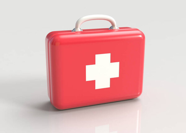 First aid kit. Red doctors bag with white cross on gray background. Emergency, healthcare, paramedic assistance concept.