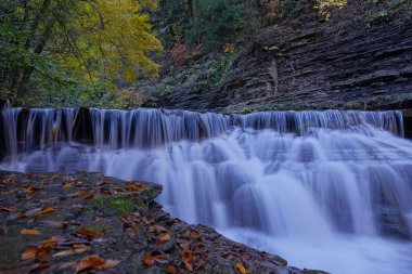 Close up of a waterfall in Stony Brook State Park New York in Autumn clipart