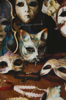 Venetian Carnival Masks Displayed in a Shop  Close-Up of Artistic Cat-Shaped Mask with Intricate Design clipart