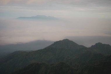 Volcano crater. Hiking. Mount Ruang Volcano Summit with Scenic Mountain View. Indonesia        clipart