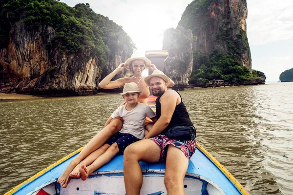 Family travel. Happy mom, dad and son on a boat trip in Thailand, Asia. Tourists. Travelers.