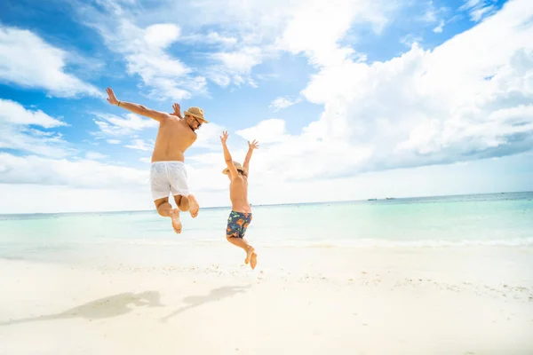 Happy Family Concept Father Son Jumping Tropical Beach Having Fun — Stok fotoğraf