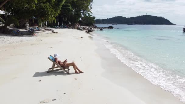Aerial View Woman Relaxing Tropical Beach Reading Book Sunbathing Tropical — Vídeo de Stock