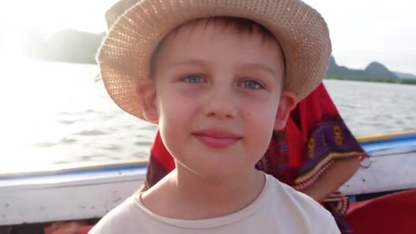 Happy Boy Boat Trip Looking Camera Smiling Wearing Summer Hat — Wideo stockowe