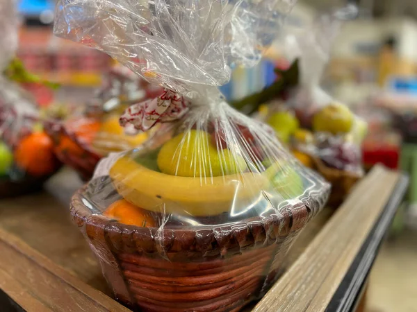 Grovetown, Ga USA - 11 02 22: colorful produce gift basket in a store corner view