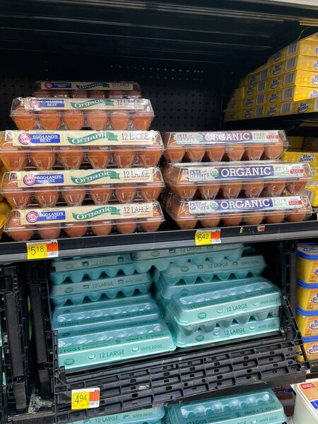 Augusta , Ga USA - 12 21 22: Walmart grocery store interior brown eggs close up and prices
