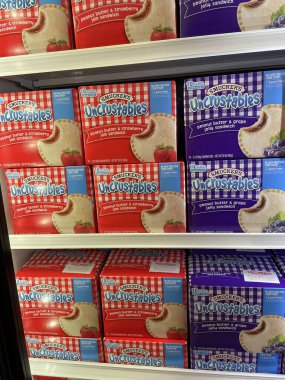 Grovetown, Ga USA - 01 06 23: Uncrustables frozen peanut butter and jelly sandwich display in a grocery store